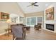 Comfortable living area with a fireplace and lots of natural light at 1065 Bookhout Drive Dr, Cumming, GA 30041