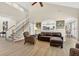 Open-concept living space with stairs, plenty of natural light, and neutral paint at 1065 Bookhout Drive Dr, Cumming, GA 30041