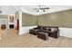 Spacious living room with a cozy seating area, fireplace, and elegant trim work at 1065 Bookhout Drive Dr, Cumming, GA 30041