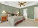 Comfortable main bedroom featuring large windows, trey ceiling, fan, and a serene ambiance at 1065 Bookhout Drive Dr, Cumming, GA 30041
