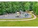 Well-equipped community playground with slides, climbing structures, and soft landing at 1065 Bookhout Drive Dr, Cumming, GA 30041