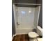 Bathroom featuring toilet and bathtub with shower insert at 5768 Windgate Ln, Lithonia, GA 30058