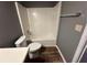 Bathroom with toilet, bathtub and shower insert at 5768 Windgate Ln, Lithonia, GA 30058