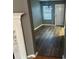 Open entryway featuring wood floors, neutral paint, and ample natural light at 5768 Windgate Ln, Lithonia, GA 30058