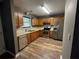 Kitchen featuring stainless steel appliances, tile backsplash, and wood cabinets at 5768 Windgate Ln, Lithonia, GA 30058