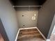 The laundry room has washer/dryer hookups and wood-look flooring at 5768 Windgate Ln, Lithonia, GA 30058