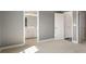A bedroom doorway leads to a bathroom with a double sink vanity and contemporary finishes at 621 Hanlon Way, Alpharetta, GA 30009