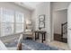 Inviting bedroom with natural light, neutral walls, accent chair, and a blue rug, creating a serene space at 621 Hanlon Way, Alpharetta, GA 30009