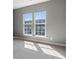 Bright bedroom featuring two windows and neutral carpet at 621 Hanlon Way, Alpharetta, GA 30009