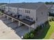 Rear exterior view of property featuring decks and garages at 621 Hanlon Way, Alpharetta, GA 30009