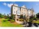 Beautiful townhomes with manicured lawns offer a welcoming neighborhood atmosphere and attractive outdoor spaces at 621 Hanlon Way, Alpharetta, GA 30009