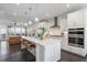 Modern open-concept kitchen with a large island, stainless appliances, and seamless access to the living area at 621 Hanlon Way, Alpharetta, GA 30009