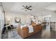 Open-concept living room with a large leather sofa and seamless flow into the modern kitchen at 621 Hanlon Way, Alpharetta, GA 30009