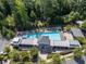 Aerial view of community pool area with lounge chairs, shelters, and landscaping at 621 Hanlon Way, Alpharetta, GA 30009