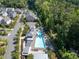 Aerial view of community pool area with lounge chairs, shelters, and landscaping at 621 Hanlon Way, Alpharetta, GA 30009