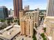 A high-angle shot reveals the building's grand facade and surrounding cityscape at 75 Ponce De Leon Ne Ave # 1006, Atlanta, GA 30308