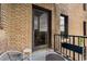 Balcony view with brick wall, outdoor seating, and neighborhood views at 75 Ponce De Leon Ne Ave # 1006, Atlanta, GA 30308