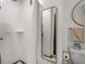 Modern bathroom featuring white subway tile in shower, stylish mirror and convenient toilet paper holder at 75 Ponce De Leon Ne Ave # 1006, Atlanta, GA 30308