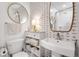 Stylish bathroom with designer wallpaper, elegant fixtures, and ample storage for a luxurious feel at 75 Ponce De Leon Ne Ave # 1006, Atlanta, GA 30308