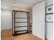 Murphy bed with wood floors, decorative wall paper and white accents at 75 Ponce De Leon Ne Ave # 1006, Atlanta, GA 30308