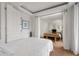 Bright bedroom with wood floors showing living area with TV, fireplace and seating at 75 Ponce De Leon Ne Ave # 1006, Atlanta, GA 30308