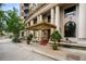 Ornate building exterior with a covered entryway, stately columns, and elegant landscaping at 75 Ponce De Leon Ne Ave # 1006, Atlanta, GA 30308