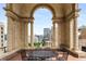 Stunning city views framed by arched columns on the covered terrace, complete with table and chairs at 75 Ponce De Leon Ne Ave # 1006, Atlanta, GA 30308