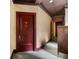 Apartment entry door and hallway with paneled walls and period details at 75 Ponce De Leon Ne Ave # 1006, Atlanta, GA 30308
