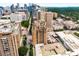 An exterior view of the building showing architectural details, skyline and surrounding buildings at 75 Ponce De Leon Ne Ave # 1006, Atlanta, GA 30308