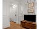 Hallway with wood floors, accent mirror, and front door at 75 Ponce De Leon Ne Ave # 1006, Atlanta, GA 30308