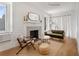 Charming living room with a fireplace, a couch, accent chair, and a cozy rug at 75 Ponce De Leon Ne Ave # 1006, Atlanta, GA 30308