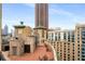 Relax on the rooftop patio with ample seating and stunning city views at 75 Ponce De Leon Ne Ave # 1006, Atlanta, GA 30308