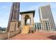 Spacious rooftop terrace showcasing a tower with staircase and unobstructed views of the surrounding urban landscape at 75 Ponce De Leon Ne Ave # 1006, Atlanta, GA 30308