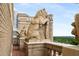 Rooftop of high-rise apartment with decorative lion sculptures overlooking trees at 75 Ponce De Leon Ne Ave # 1006, Atlanta, GA 30308