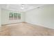 Spacious bedroom featuring a tray ceiling and a large window letting in natural light at 288 Old Burnt Hickory Rd, Acworth, GA 30101
