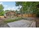 Inviting backyard showcasing a screened-in porch, wooden fence, stone fire pit, and patio for outdoor entertaining at 1633 Woodbine Ne Ave, Atlanta, GA 30317
