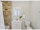 Bathroom featuring tiled walls, a vanity with storage, and a shower with a curtain at 1633 Woodbine Ne Ave, Atlanta, GA 30317