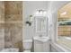 Well-lit bathroom with a vanity, medicine cabinet, and combination shower and bathtub at 1633 Woodbine Ne Ave, Atlanta, GA 30317