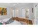 Bedroom featuring a sliding barn door leading to the bathroom, hardwood floors, and natural light at 1633 Woodbine Ne Ave, Atlanta, GA 30317