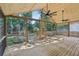 Large covered deck with wood ceiling, ceiling fans, and screened walls for outdoor enjoyment overlooking the backyard at 1633 Woodbine Ne Ave, Atlanta, GA 30317