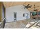 Covered deck with wood flooring, fans, and bright white walls offering a cozy space with screened walls overlooking the yard at 1633 Woodbine Ne Ave, Atlanta, GA 30317