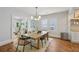Elegant dining area with hardwood floors and an open layout into the inviting living room at 1633 Woodbine Ne Ave, Atlanta, GA 30317