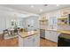Charming kitchen with butcher block countertops, white cabinetry, and open dining area at 1633 Woodbine Ne Ave, Atlanta, GA 30317