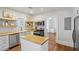 Modern kitchen with stainless steel appliances, butcher block countertops and open shelving at 1633 Woodbine Ne Ave, Atlanta, GA 30317