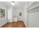 Functional room featuring built-in cabinets, hardwood flooring, and ample natural light from the large window at 1633 Woodbine Ne Ave, Atlanta, GA 30317