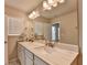 Well-lit bathroom with dual sinks, marble countertop, and large mirror, providing a luxurious and functional space at 2719 Hedgeway Cir, Kennesaw, GA 30144