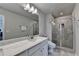 Bright bathroom features dual sinks with marble counters and modern fixtures, complemented by a glass enclosed shower at 2719 Hedgeway Cir, Kennesaw, GA 30144