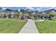 Community green space with a gazebo surrounded by sidewalks and townhomes at 2719 Hedgeway Cir, Kennesaw, GA 30144