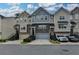 Attractive townhome exterior with varied colors, stone accents, front garages, and landscaped entryways at 2719 Hedgeway Cir, Kennesaw, GA 30144