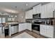 Well-appointed kitchen featuring stainless appliances, granite counters, and an open layout to the dining area at 2719 Hedgeway Cir, Kennesaw, GA 30144